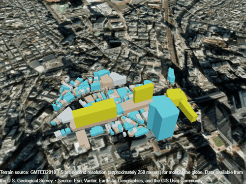 Yellow, gray, blue, and tan buildings displayed over satellite imagery